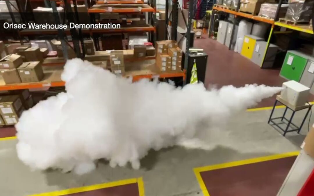 A density fog security system being activated within a warehouse