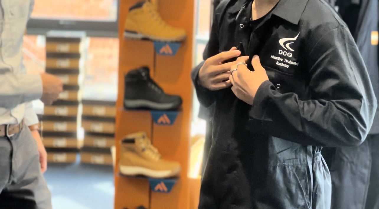 Student wearing a protective boiler suit 