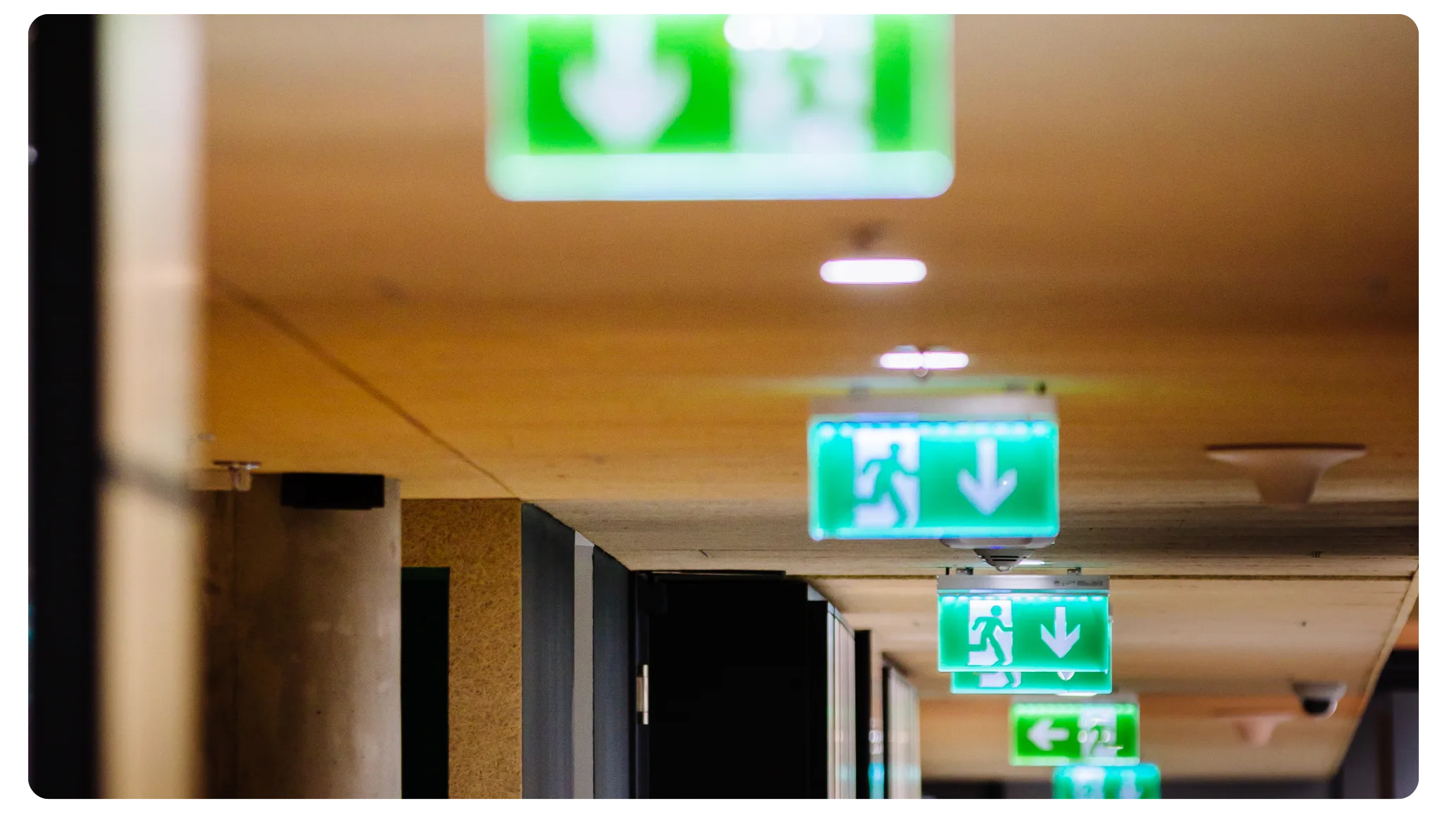 Wayfinding emergency lighting installed down a corridor
