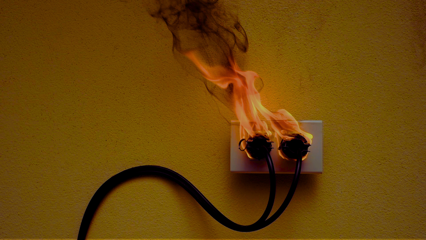 Example of an electrical plug socket fire illustrating a common electrical hazard.