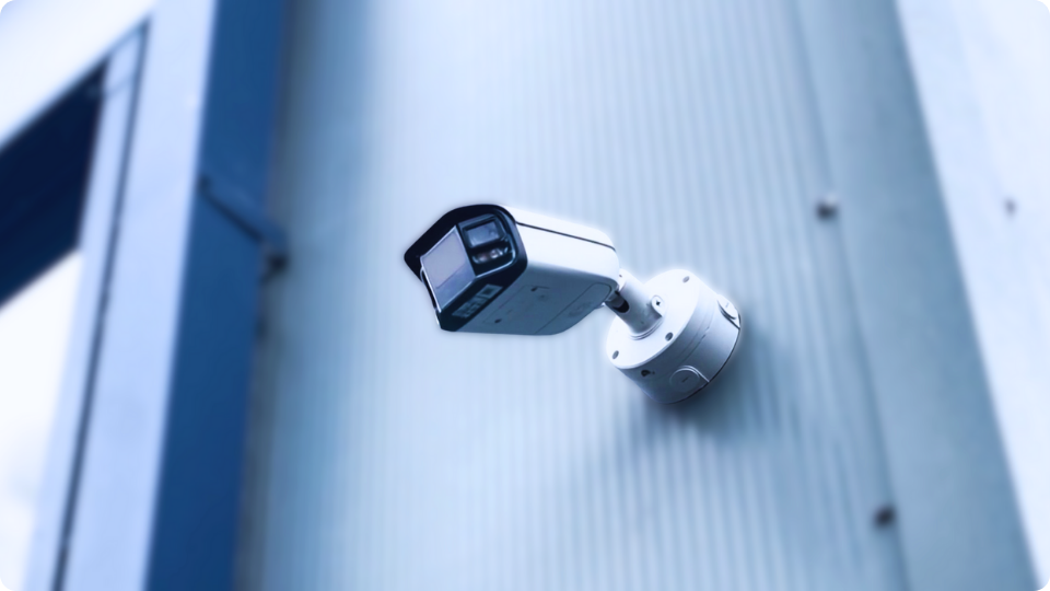 Cortex CCTV camera system mounted on a commercial building exterior providing 24/7 business security monitoring.