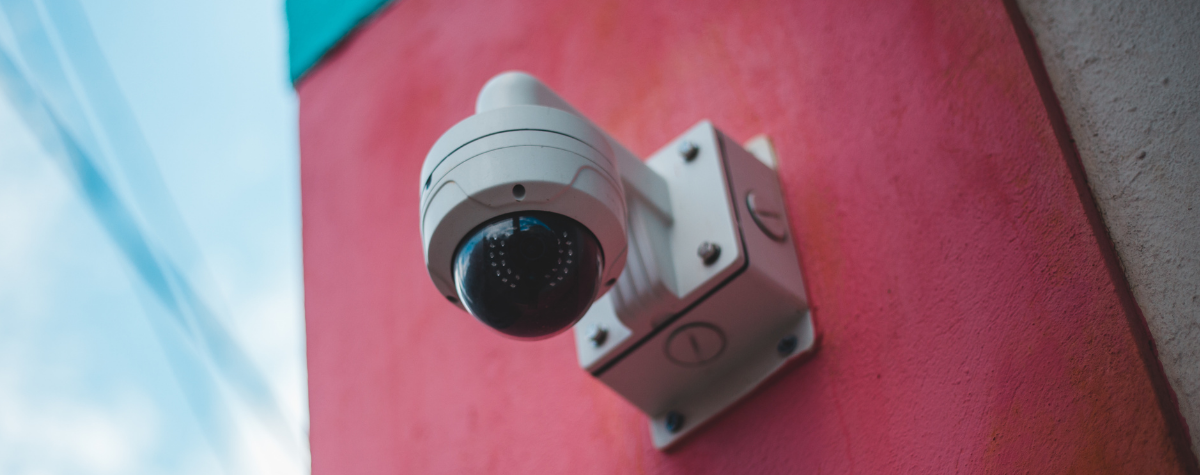 A dome CCTV camera attached to a wall