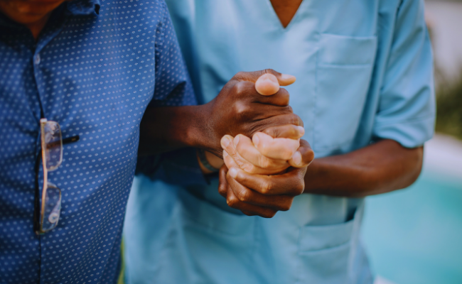 A blue keyholding icon over a background depicting care home security