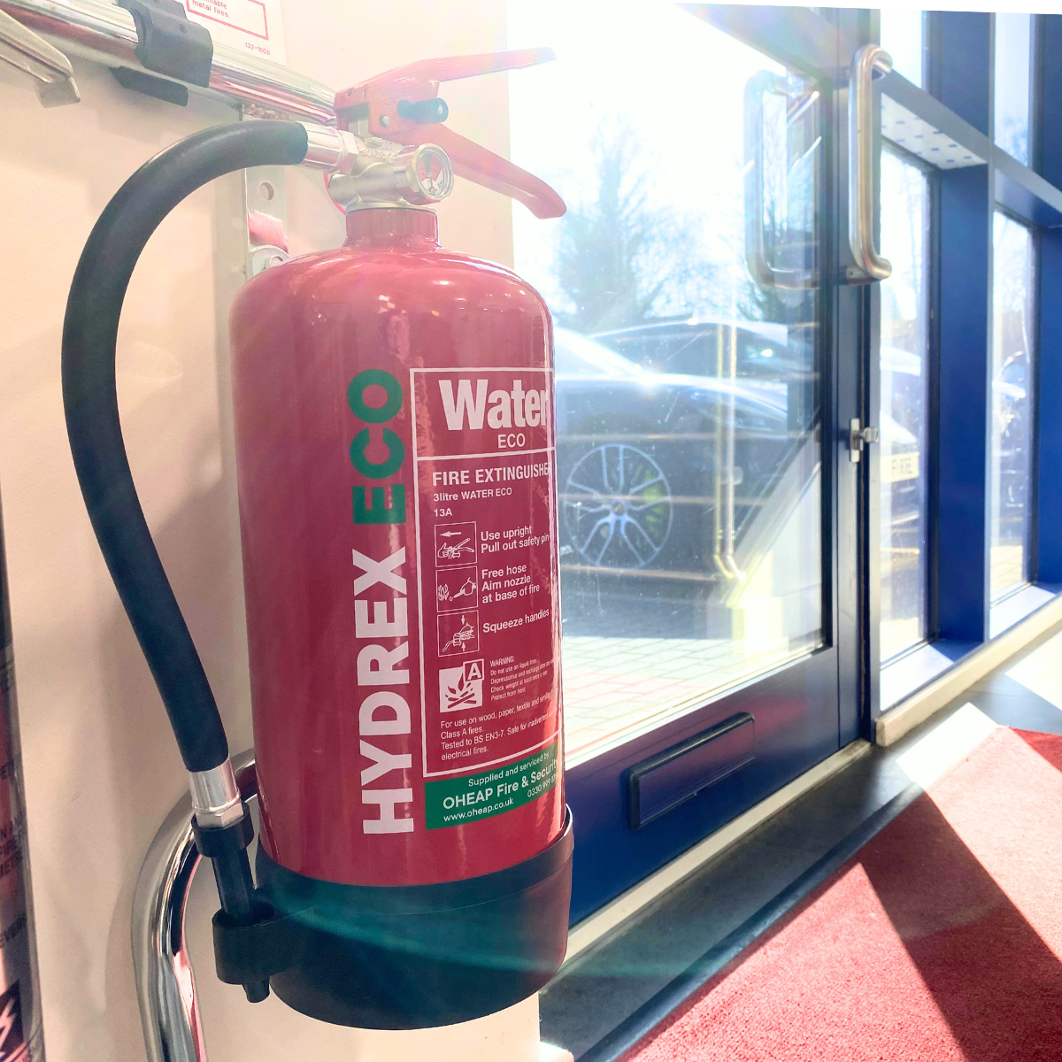 A Hydrex-eco fire extinguisher serviced and installed inside a building