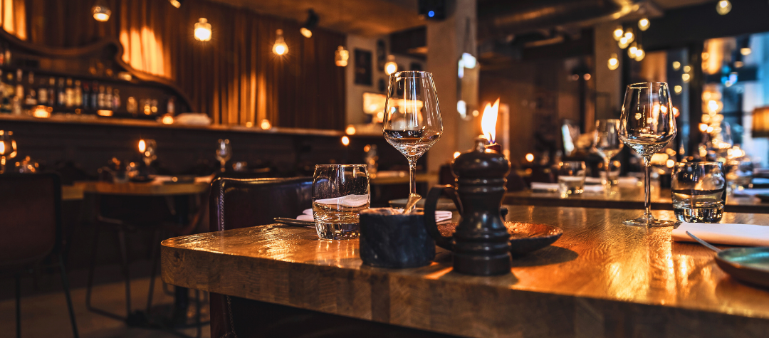 A dimly lit bar where hospitality fire safety is successfully practiced.