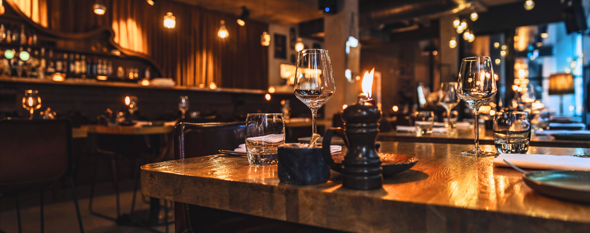 A dimly lit bar where hospitality fire safety is successfully practiced. 