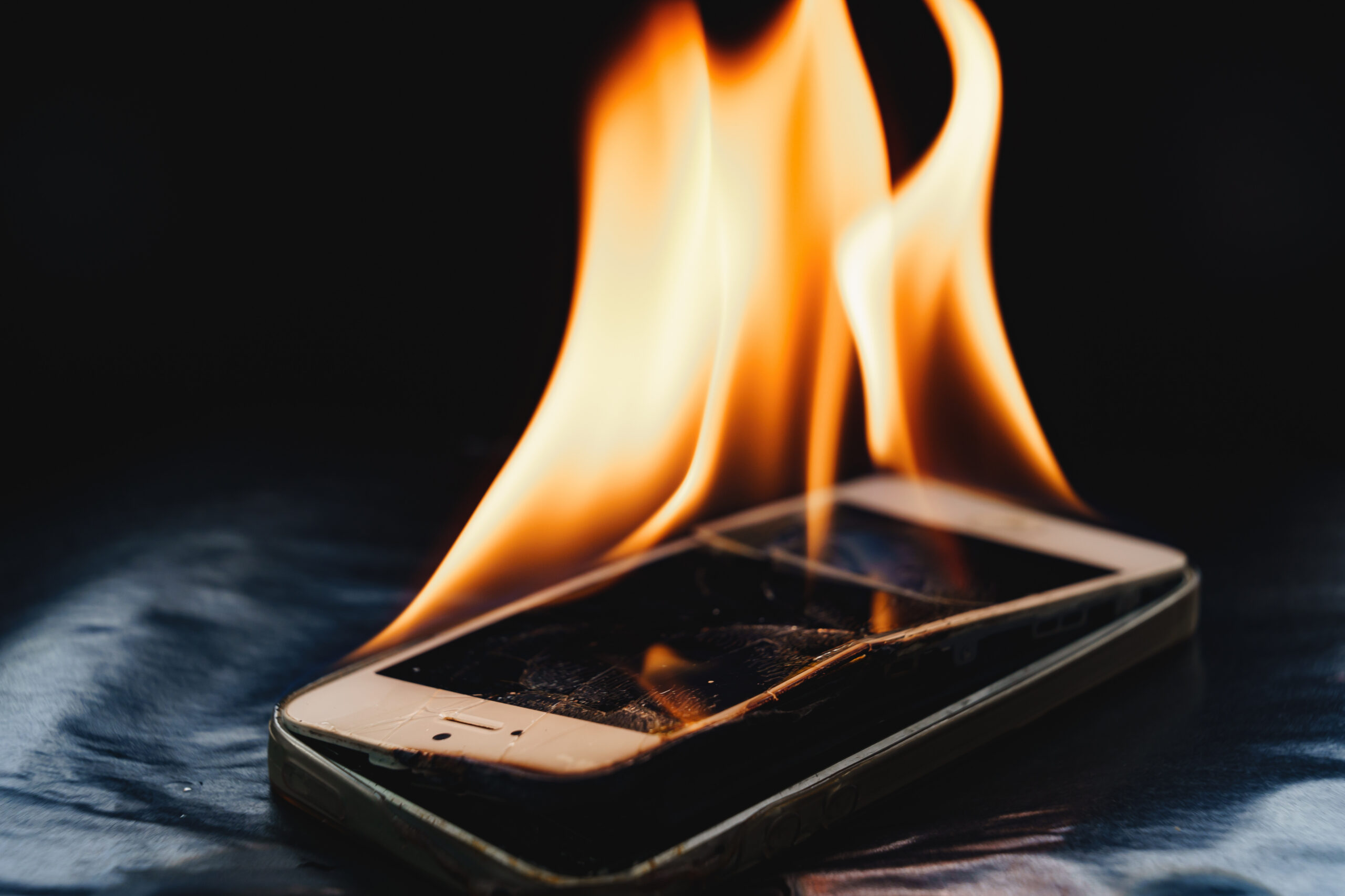A phone burning in a Class L fire caused by thermal runaway